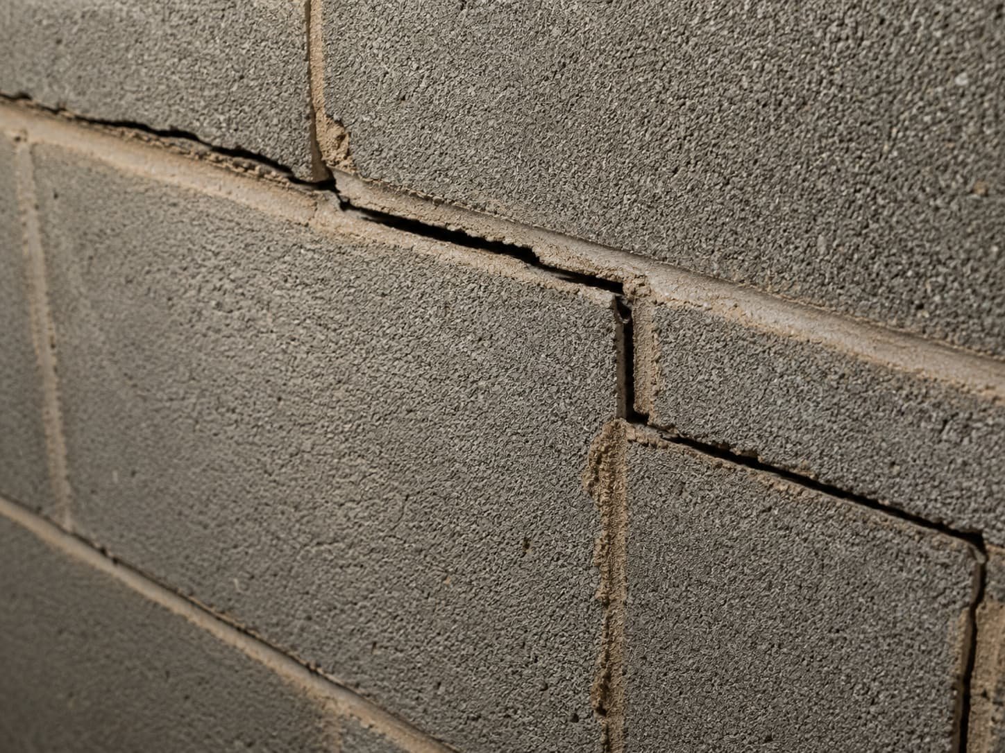 Foundation cracks stair-step crack in a concrete block wall
